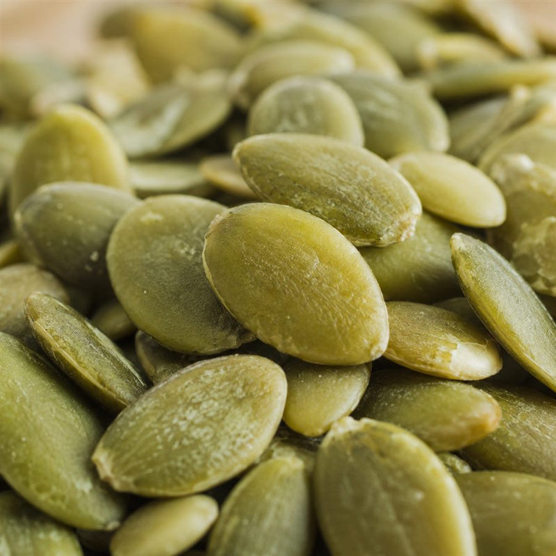 Close-up of raw green pumpkin seeds